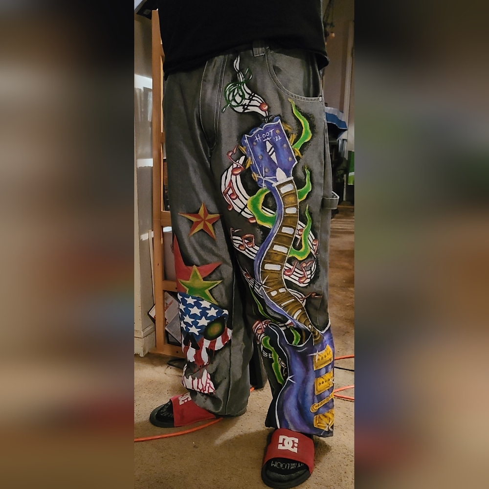 One of a kind custom "Fly Zone" silver metallic jeans.